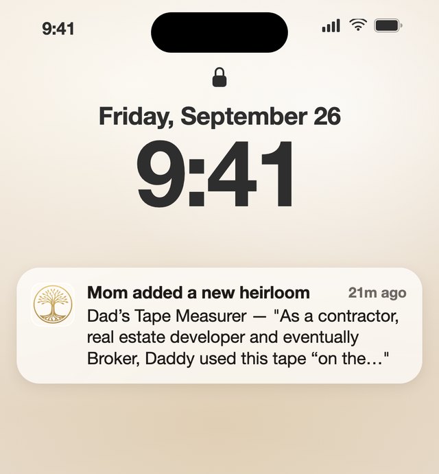 A phone lock screen at 9:41 with a notification: Mom added a new heirloom